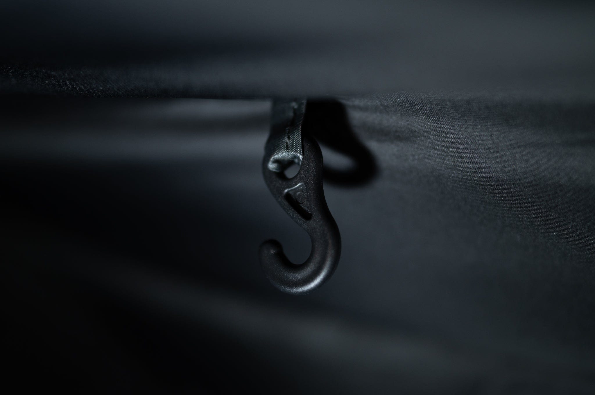 Close-up of the internal light hook inside the Crua Culla Hammock Wrap, providing a convenient lighting attachment point.