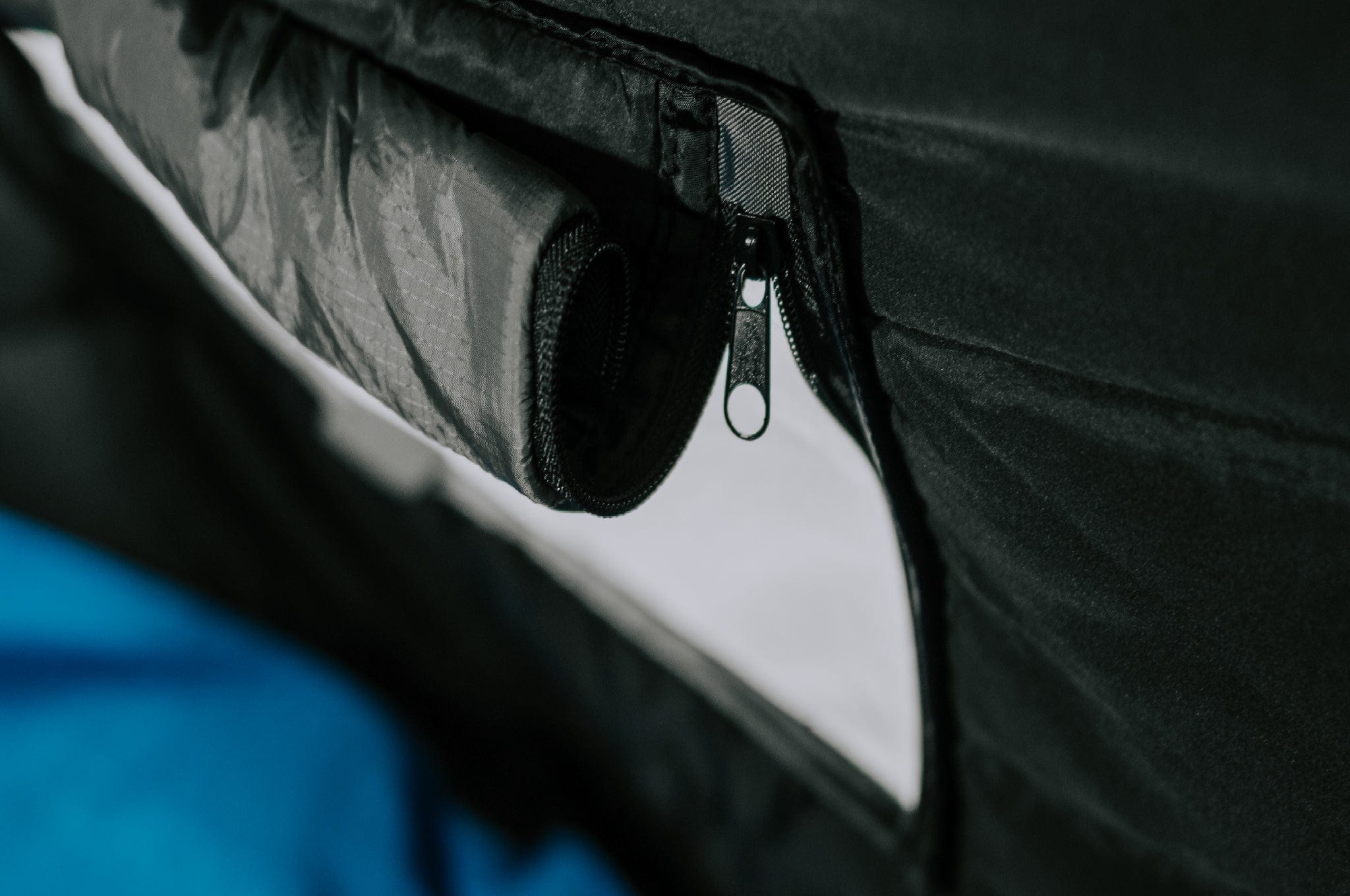 Close-up of the internal window of the Crua Culla Hammock Wrap rolled up, showcasing ventilation options.