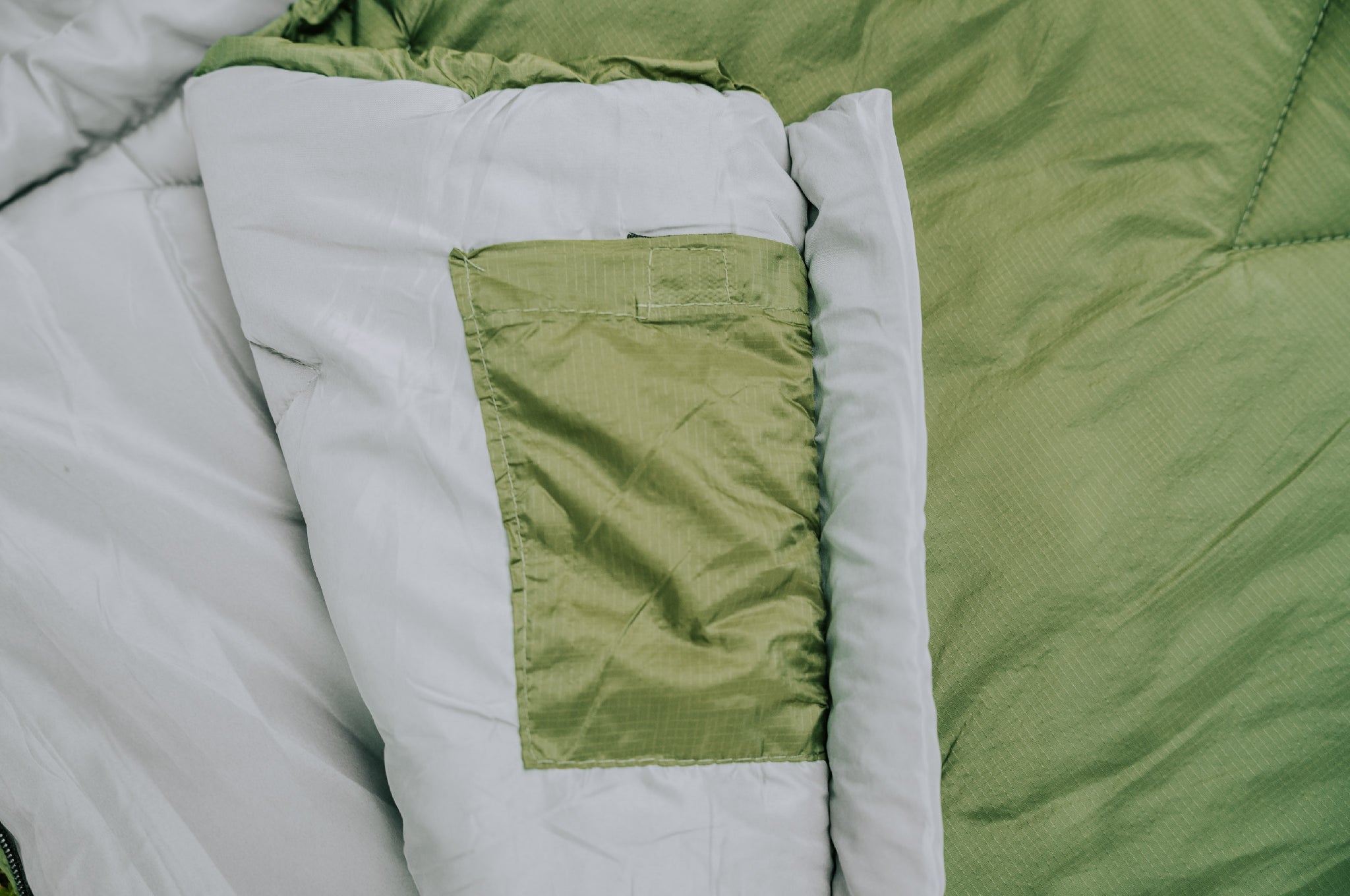 Close-up of the mobile phone pocket within the Crua Graphene Sleeping Bag.